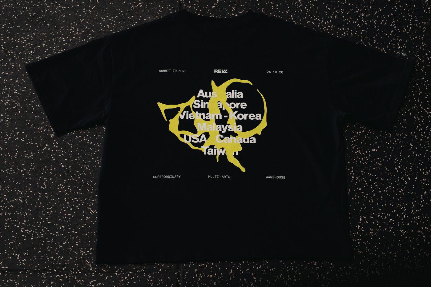 The RTG tee laid flat, back: the custom global graphic
